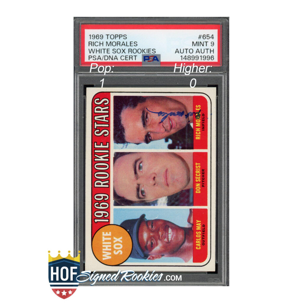 Tall image of a vintage 1969 Topps rookies baseball card strip in a protective case, featuring Rich Morales and other White Sox rookies on a red-bordered label and card faces.